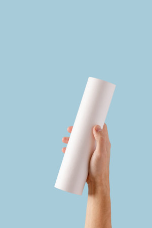 hand water filter. cartridge with a carbon filter of household drinking water purification systems in hands on a blue backgroundの写真素材
