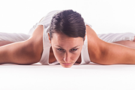 Woman practicing yoga doing the \"Bound Angle Pose\" posture. Baddha Konasanaの写真素材