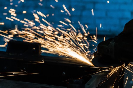 Metal grinding with bright sparks