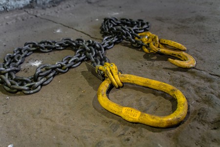 Metal chain with yellow hooksの写真素材