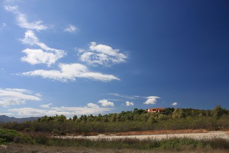 dry lagoon behind the beach of Cala Brandinchiの写真素材