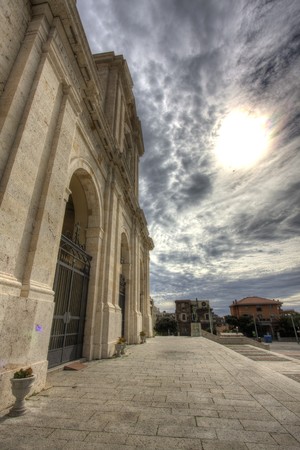 Big sun and catholic churchの写真素材
