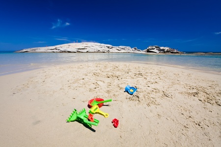 Toys for a child to have fun in a beautiful beachの写真素材