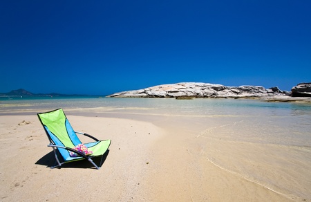 Chair isolated in beautiful beachの写真素材