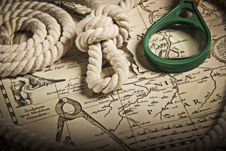magnifier on old, vintage, antique map. Backgroundの写真素材