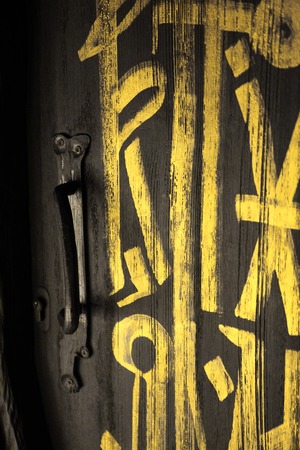 Dark grey door or black door with golden letters on itの写真素材