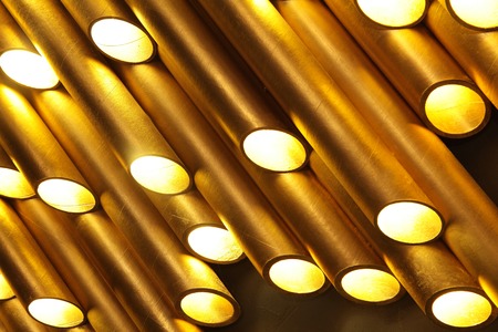 Golden tube lamp. texture closeupの写真素材
