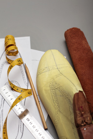 Modelling design of a shoes.Workplace of shoe designer Selective focus.Copy space.Top viewの写真素材
