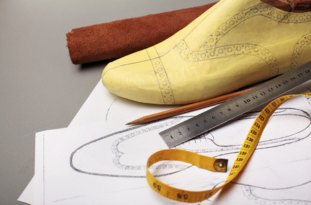 Modelling design of a shoes.Workplace of shoe designer Selective focus.Copy space.の写真素材