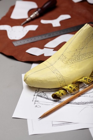 Modelling design of a shoes.Workplace of shoe designer Selective focus.Copy space.の写真素材
