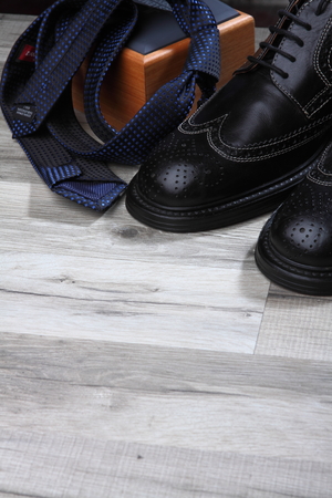 Brogue with brushes and wax on the wooden textures . Background.Shoes careの写真素材