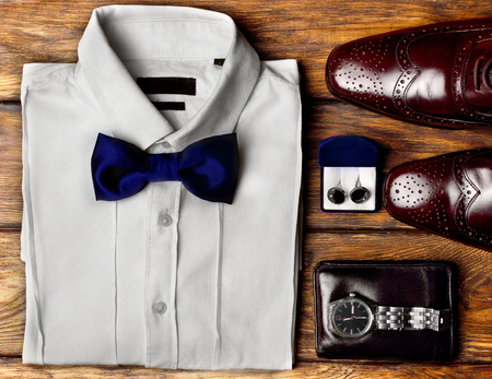 Dark brown brogues, white shirt and men's accessroies cufflinks, watch, leather belt, leather potmone wallet . Men's look .Set of gentlemen.の写真素材