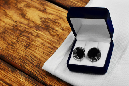 cufflinks on dark blue blue boxConcept of luxury men's look