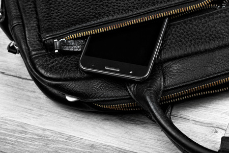 Smartphone in businessman bag closeup.Copy space cellphone concept advertisingの写真素材