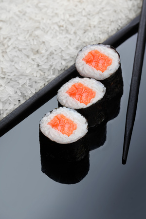 Three maki roll sushi with salmon. Sushi menu. Japanese food. copy spaceの写真素材
