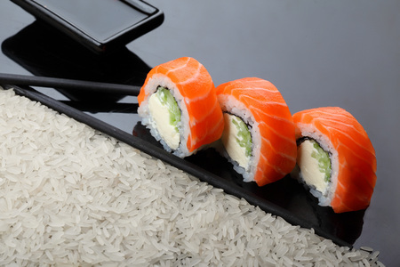 Philadelphia roll sushi with salmon, prawn, avocado, cream cheese. Sushi menu. Japanese food. copy spaceの写真素材