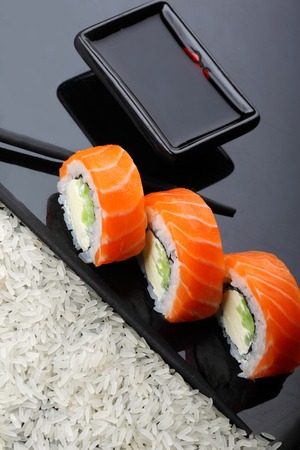 Philadelphia roll sushi with salmon, prawn, avocado, cream cheese. Sushi menu. Japanese food. copy spaceの写真素材