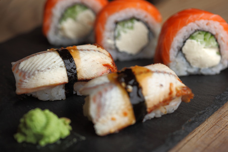 Sashimi sushi set with Philadelphia roll sushi on black slate plate background.Nigiri.Closeupの写真素材