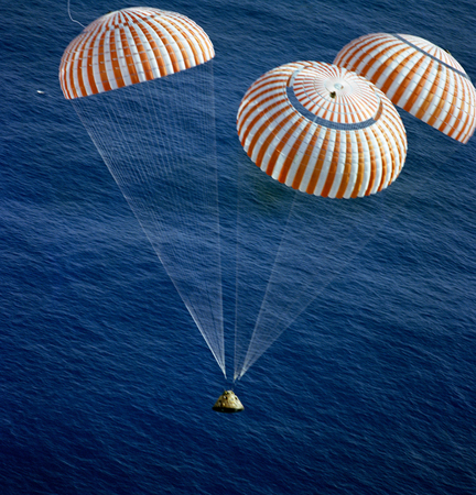 The Apollo 17 Command Module (CM), with astronauts Eugene A. Cernan, Ronald E. Evans and Harrison H. Schmitt aboard, nears splashdown in the South Pacific Ocean.This image furnished by NASAのeditorial素材