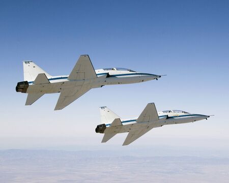 NASA Dryden's two T-38A mission support aircraft fly in tight formation, Sept 26th, 2007. this image...