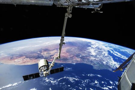 The International Space Station's Canadarm2 prepares to release the Orbital Sciences Corporation's commercial cargo craft. Aug 15th, 2014. this image elements furnished by nasaの写真素材