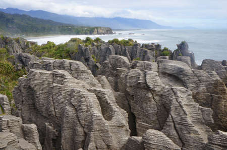The Pancake Rocks at Dolomite Point near Punakaiki are heavily eroded limestone area where the sea...