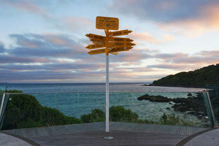Global Signpost in Stirling Point showing direction and distance to cities around the World, Bluff, New Zealandの写真素材
