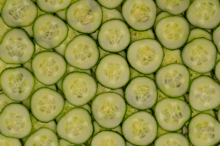Background pattern of fresh cucumber slicesの写真素材