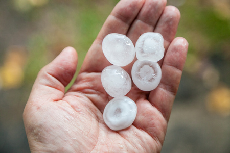 very large hail in the handsの写真素材