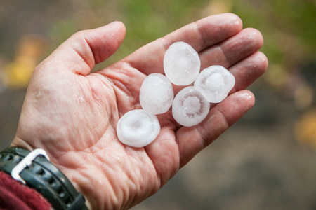 very large hail in the handsの写真素材