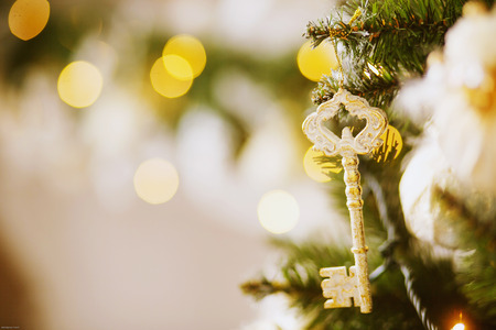 Key hanging on a Christmas treeの写真素材
