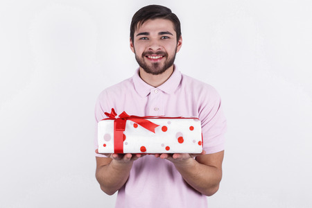 Happy emotional man with gifts on special dayの写真素材