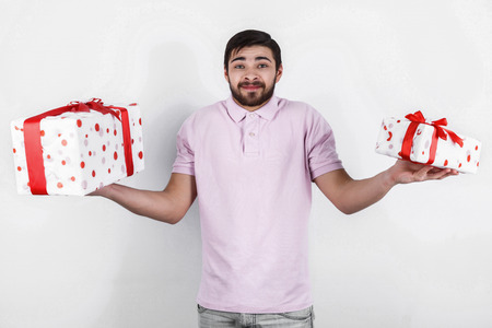 Happy emotional man with gifts on special dayの写真素材
