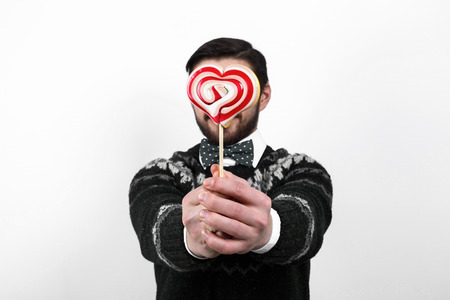 valentine romantic man holding candy heart