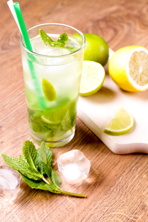 Tasty mojito on the wooden table backgroundの写真素材