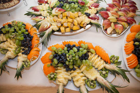Healthy fruit table at wedding reception catering: pineapple grapesの写真素材