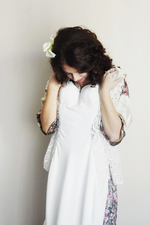 Bride tries on a wedding dressの写真素材