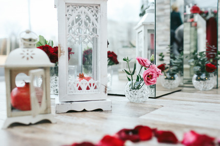 White wooden lantern with pomegranate stands on the floorの写真素材