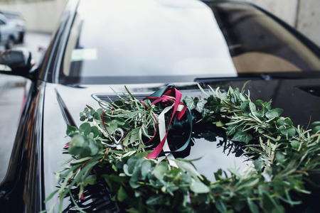Green wreath on the black motor hoodの写真素材
