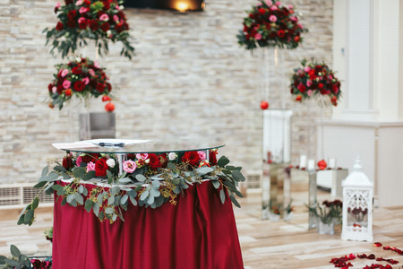 Table for marriage registration decorated with roses and greeneryの写真素材