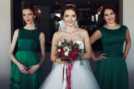 Bride with bridesmaids in green dressesの写真素材