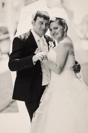 Black and white portrait of happy newlywedsの写真素材