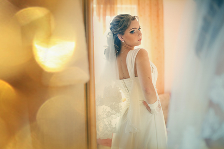 Bride looks in the mirrorの写真素材