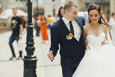 Just married walk around smiling in the old part of the cityの写真素材