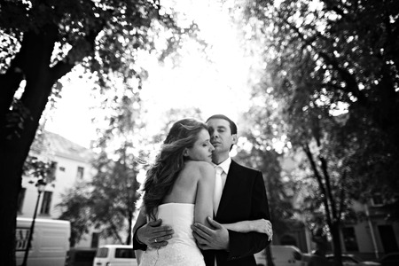 Lady leans to the man's face hugging himの写真素材