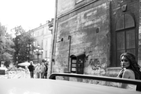 A view on a troubled lady over the car roofの写真素材
