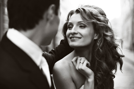 Man holds woman hair while she smilesの写真素材