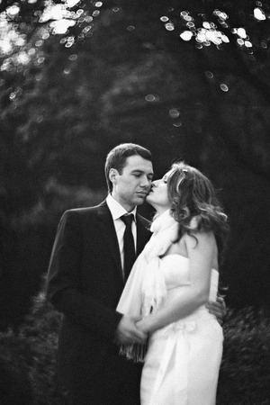Lady kisses a man somewhere in the forestの写真素材