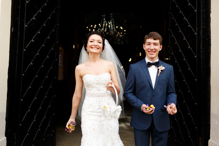 Just married couple through away sweets to the guestsの写真素材