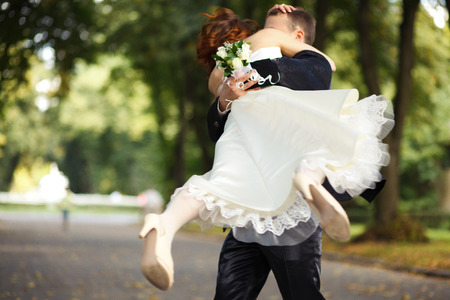 Never let you down -- groom whirls a brideの写真素材